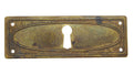 Schlüsselblatt Regency Oval Messing Antik